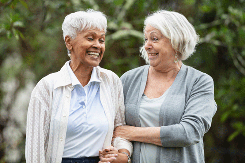 A woman, using advice for visiting older loved ones, spends time with a family member who has dementia.