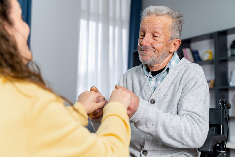 A woman supports her older loved one in living better with COPD.